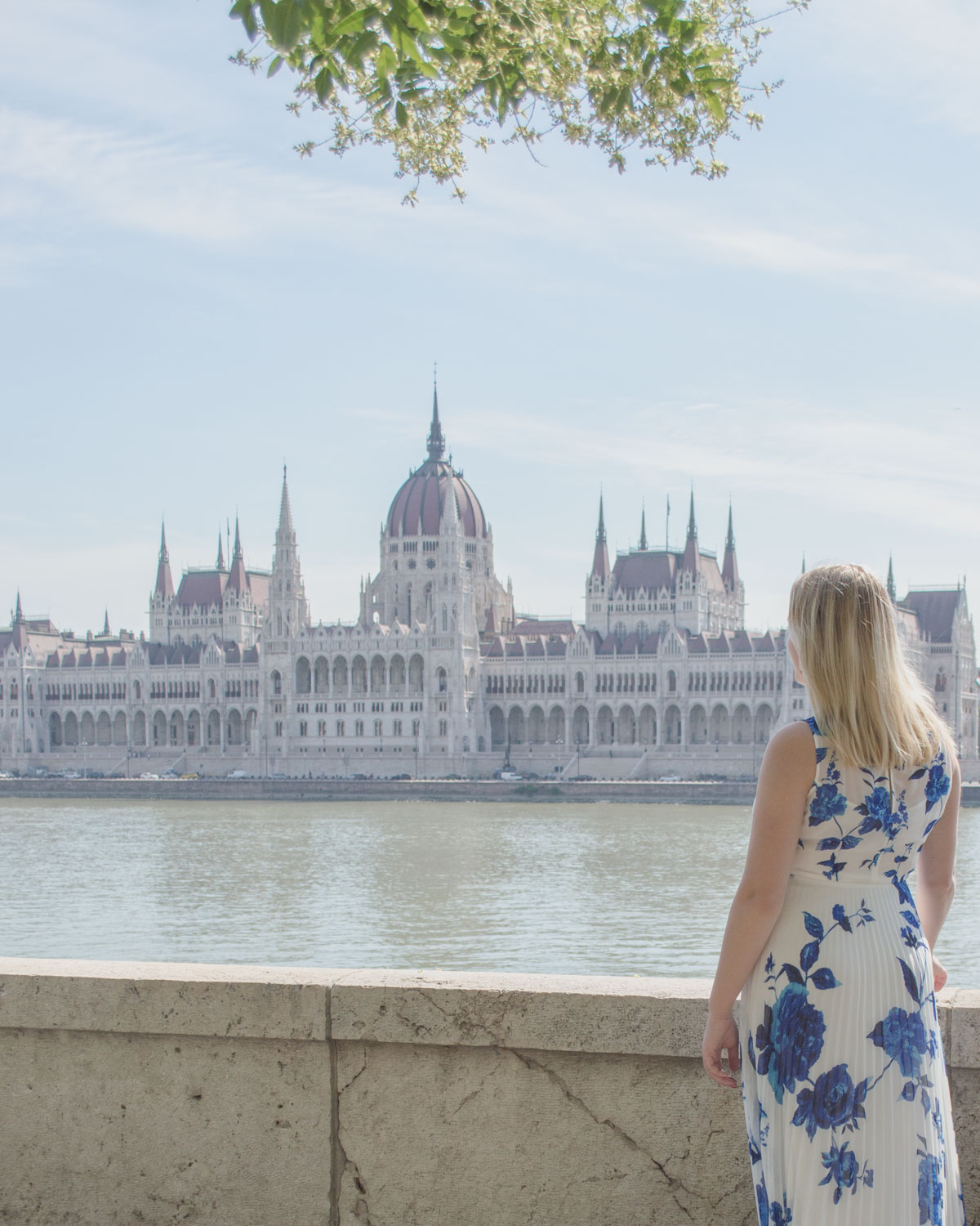 Woman overlooking the Hungarian Parliament in Budapest