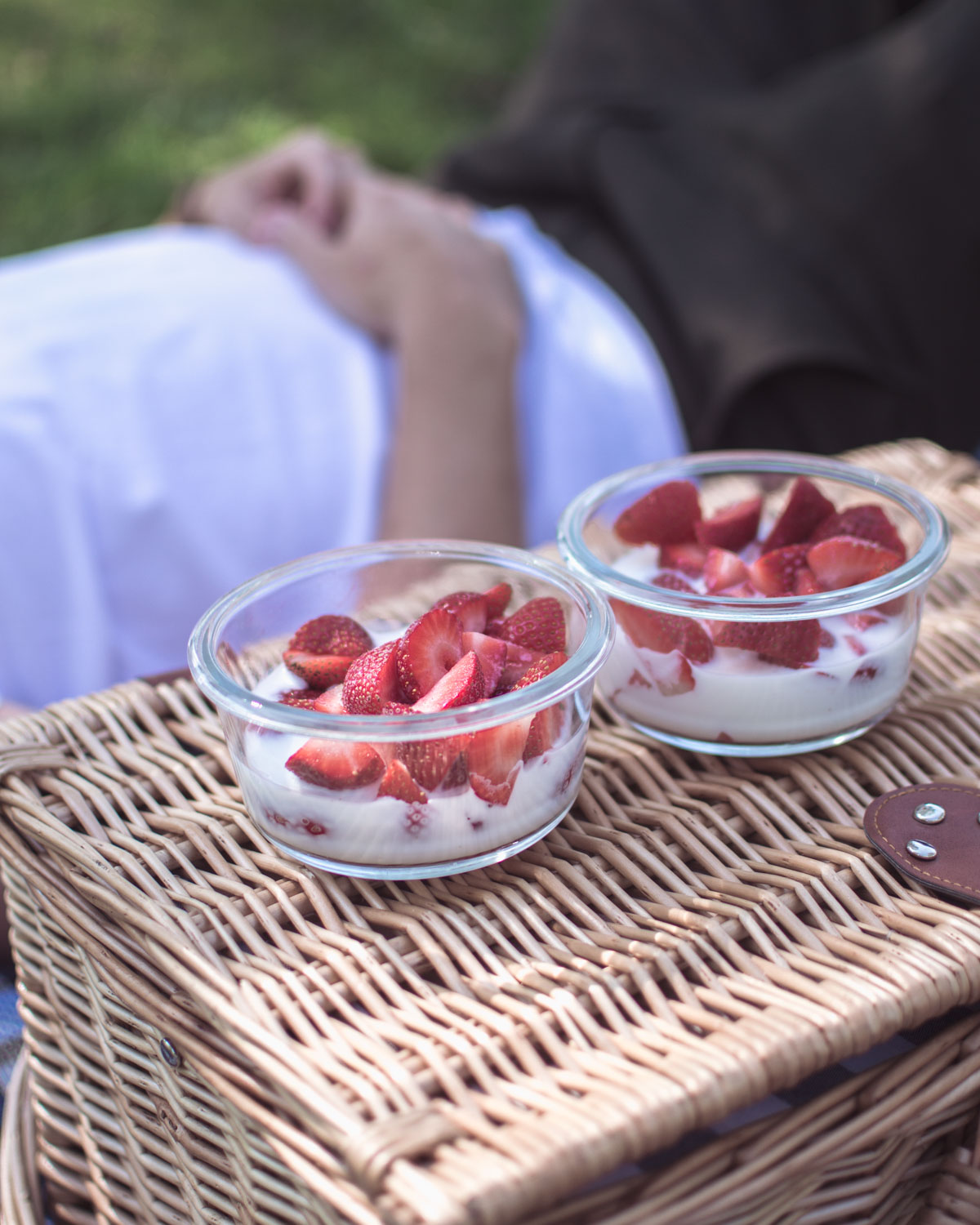 Man lhaving strawberry picnic